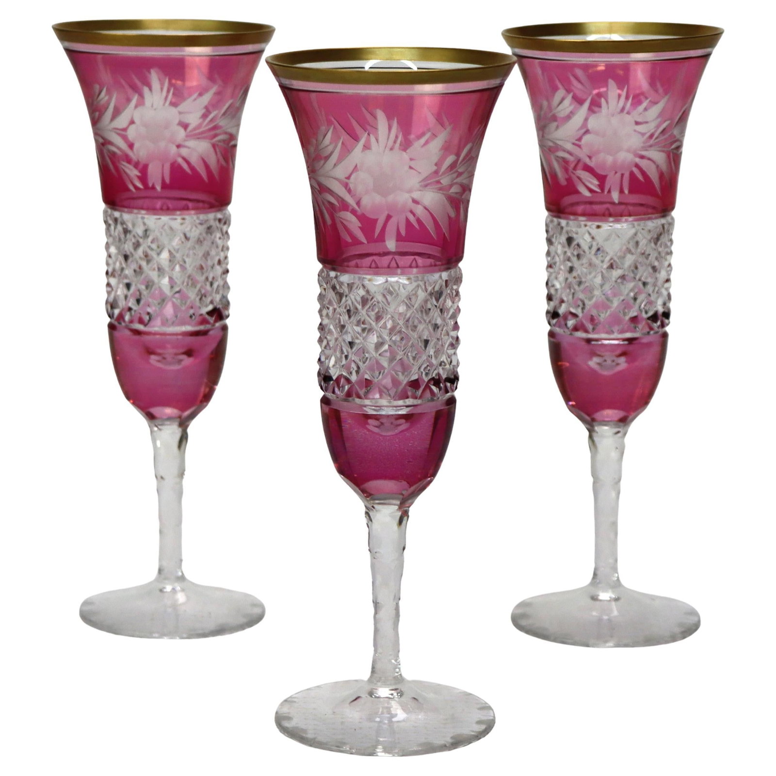 Set of 3 Early 20th Century Bohemian Rose Cut to Clear Champagne Flutes: Set of 3 Early 20th Century Bohemian Rose Cut to Clear Champagne Flutes This set includes three antique Bohemian champagne flutes, each crafted from cut-to-clear crystal and featuring a rose floral mo