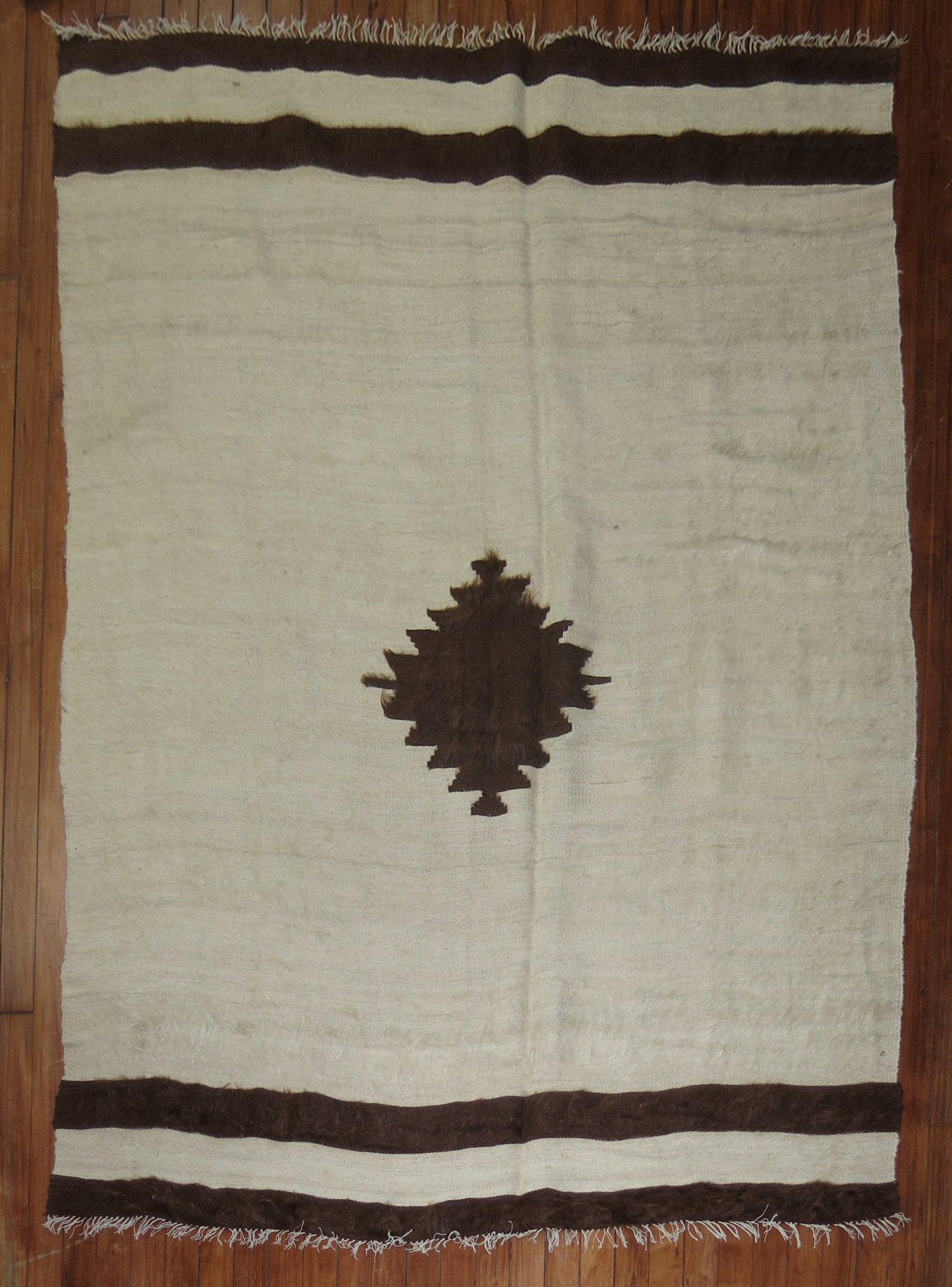 4' 8" x 6' Turkish Mohair Accent Carpet in Ivory: 4' 8" x 6' Turkish Mohair Accent Carpet in Ivory Vintage Turkish mohair carpet in an ivory tone, designed as an accent rug. This pre-owned piece dates to the mid 20th century. Specifications Title: Vi