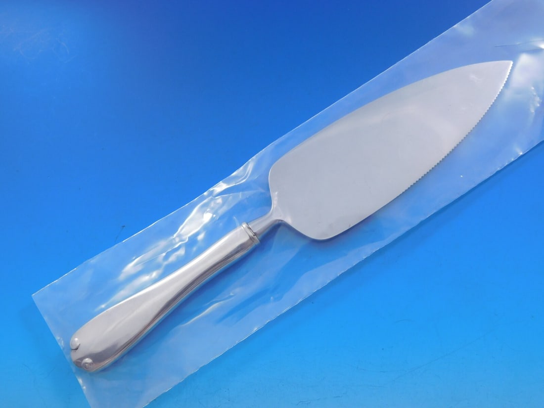 Tiffany & Co. Flemish Sterling Silver Cake Server 10 1/8 inches: Tiffany & Co. Flemish Sterling Silver Cake Server 10 1/8 inches Presenting the exquisite Flemish Cake Server by Tiffany & Co., a stunning piece crafted in sterling silver with a custom-made hollow han