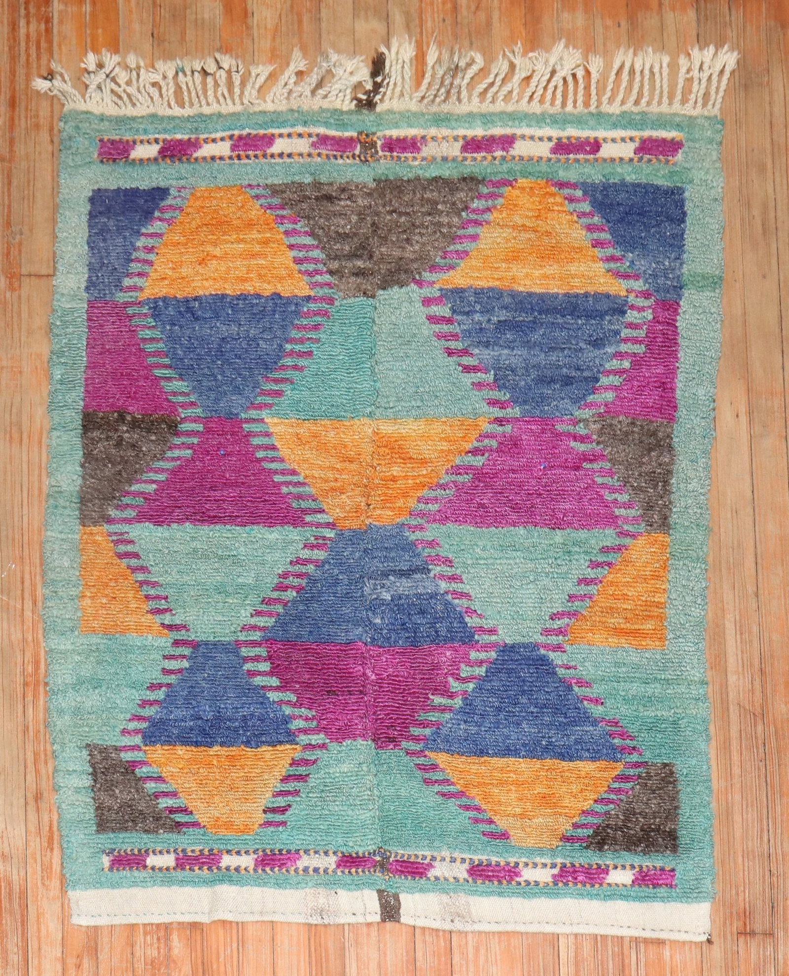 3' 7" x 4' 7" Mid Century Konya Tulu Rug: 3' 7" x 4' 7" Mid Century Konya Tulu Rug Mid-century Turkish Tulu rug with a colorful geometric design and fringed edges. This pre-owned small square rug is identified as a Konya Tulu. Specifications 