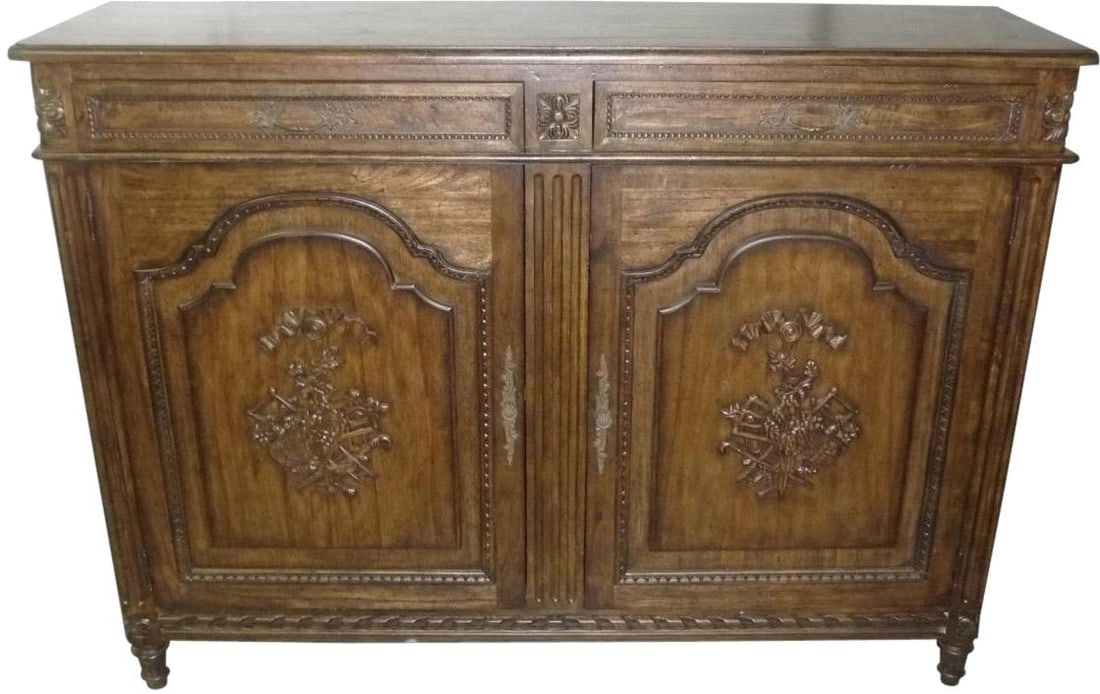 French Louis XVI Style Sideboard Distressed Walnut Mindi Construction: French Louis XVI Style Sideboard Distressed Walnut Mindi Construction This elegant French Louis XVI Style Sideboard is a perfect blend of sophistication and functionality. Crafted from Mindi wood, it 
