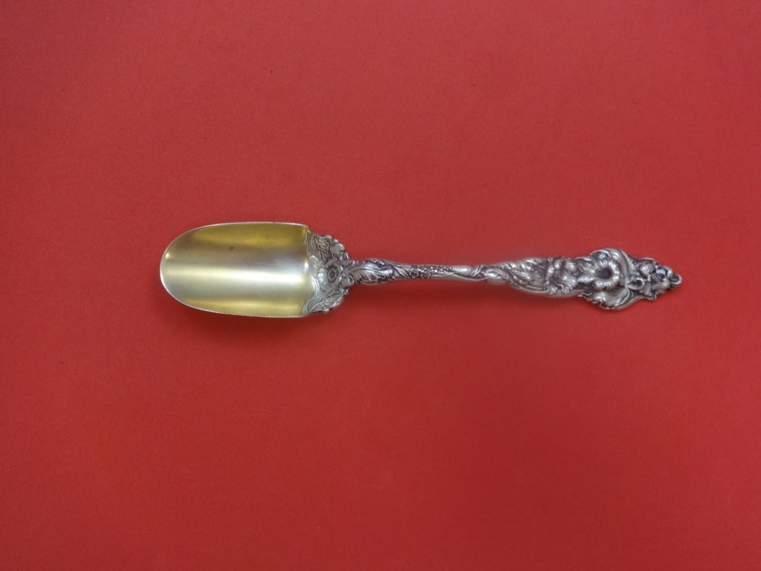 Reed & Barton Les Six Fleurs Sterling Silver Cheese Scoop 8.5" Gold Wash: Reed & Barton Les Six Fleurs Sterling Silver Cheese Scoop 8.5" Gold Wash Enhance your serving collection with this elegant cheese scoop from the Les Six Fleurs pattern by Reed & Barton. Crafted from h