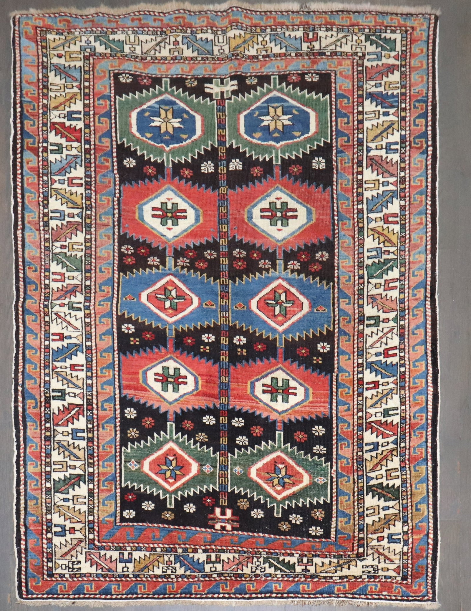3' 2" x 4' 4" Early 20th Century Shirvan Caucasian Rug: 3' 2" x 4' 4" Early 20th Century Shirvan Caucasian Rug Early 20th century Caucasian Shirvan rug in a small square format. This pre-owned rug is identified as a Caucasian Shirvan example. Specification
