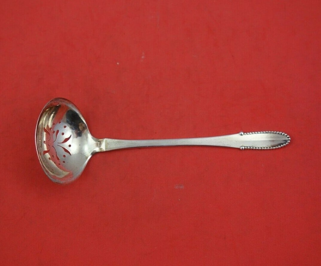Georg Jensen Beaded Sterling Silver Sugar Sifter Ladle 5 3/4 Inch: Georg Jensen Beaded Sterling Silver Sugar Sifter Ladle 5 3/4 Inch This elegant sugar sifter ladle by Georg Jensen features a beautiful beaded design, crafted from high-quality sterling silver. Measuri