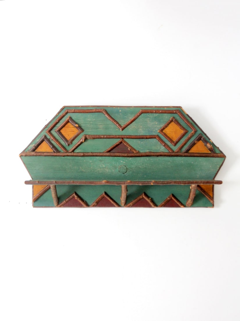 Vintage Rustic Wall Shelf 44.75 x 22 x 7.25 Inch: Vintage Rustic Wall Shelf 44.75 x 22 x 7.25 Inch This vintage wall shelf combines rustic charm with modern design elements, featuring intricate woodwork and earthy tones that create a warm, inviting a