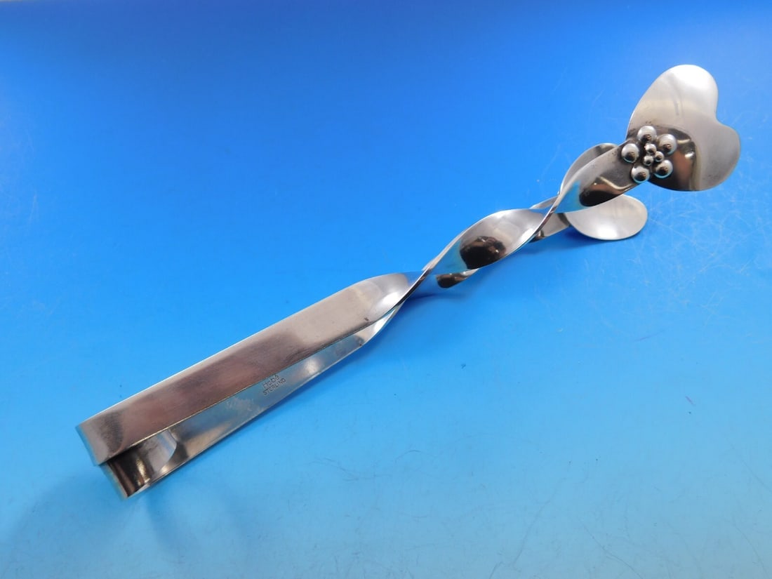Hobe Handwrought Sterling Silver Twisted Ice Tong 7.5 Inch Serving Piece: Hobe Handwrought Sterling Silver Twisted Ice Tong 7.5 Inch Serving Piece This exquisite handwrought ice tong by Hobe measures 7 1/2 inches and is crafted from high-quality sterling silver. Featuring a