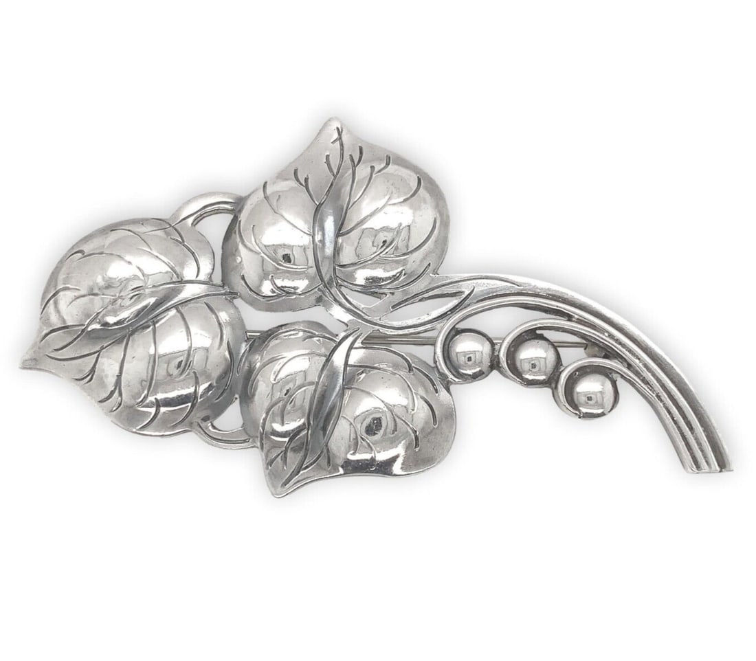 Kalo Sterling Silver Three Leaf Beaded Pin by Bjarne Axness: Kalo Sterling Silver Three Leaf Beaded Pin by Bjarne Axness This exquisite Sterling Kalo Three Leaf Medium Pin is a handwrought masterpiece crafted by Bjarne Axness, a skilled artisan from the renowne