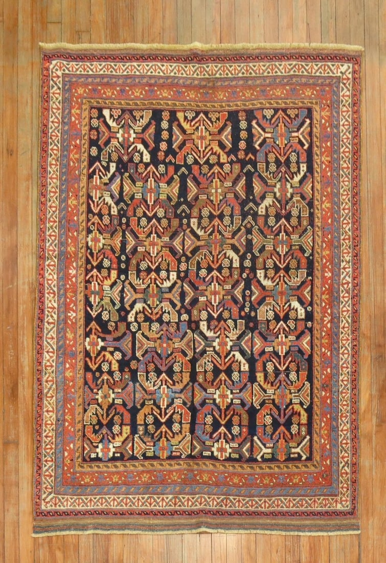 4' 3" x 5' 8" Early 20th Century Persian Afshar Accent Rug: 4' 3" x 5' 8" Early 20th Century Persian Afshar Accent Rug Early 20th century Persian Afshar accent rug featuring an all-over design with red and orange accents on a navy ground. This pre-owned rug sh