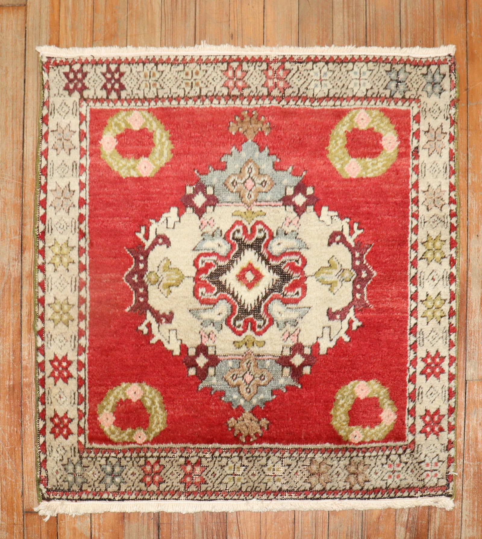 2' 4" x 2' 4" Turkish Sivas square rug in red: 2' 4" x 2' 4" Turkish Sivas square rug in red Small Turkish Sivas square rug from the middle of the 20th century. This pre-owned piece features a red field with a central medallion and floral motifs, 