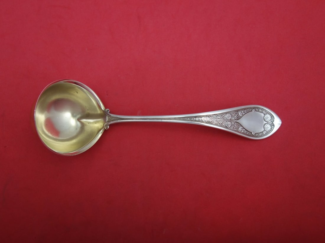 Wood and Hughes Marguerite Sterling Silver Gravy Ladle Gold Wash 7 1/8": Wood and Hughes Marguerite Sterling Silver Gravy Ladle Gold Wash 7 1/8" This exquisite gravy ladle from the Marguerite pattern by Wood and Hughes showcases the elegance of sterling silver craftsmanshi
