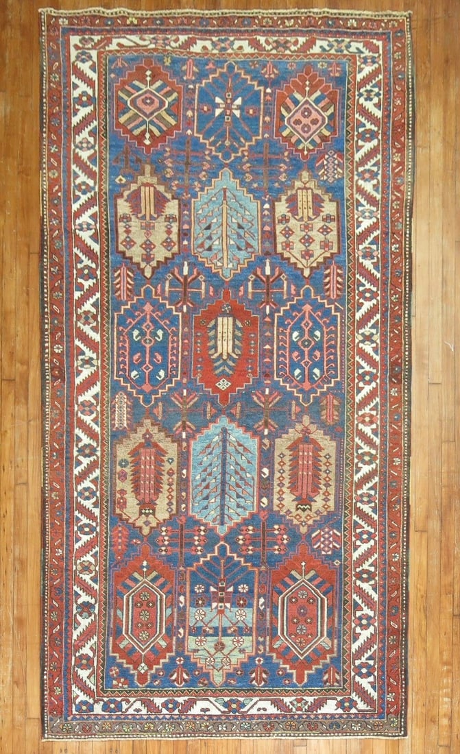 Early 20th Century Bakhtiari Tribal Rug 5' 4" x 10' 1": Early 20th Century Bakhtiari Tribal Rug 5' 4" x 10' 1" Early 20th century Bakhtiari rug with a tribal geometric design. This pre-owned gallery-size rug is identified as a N.W. Persian Baktiari type. S