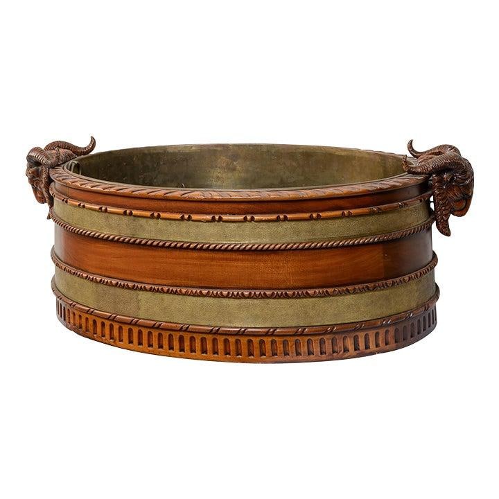 Mahogany Cellarette with Brass Ram Head Accents and Original Liner Circa 1920s: Mahogany Cellarette with Brass Ram Head Accents and Original Liner Circa 1920s This exquisite Antique English Cellarette, crafted from mahogany and adorned with striking brass ram heads, serves as a c