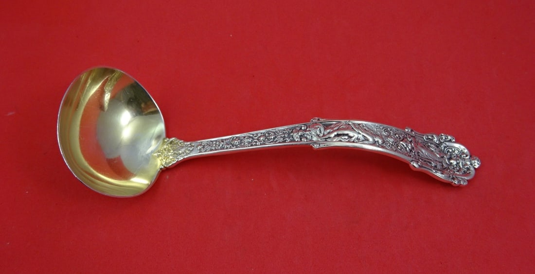 Gold Washed Sterling Gravy Ladle Coligni Pattern 7.5 Inch: Gold Washed Sterling Gravy Ladle Coligni Pattern 7.5 Inch This is a Gorham Coligni pattern sterling silver gravy ladle featuring a gold washed finish. Measuring 7 1/2 inches in length, this multi-moti