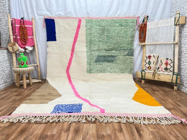 Authentic Handwoven Colorful Rug from Morocco 8 x 5 Feet: Authentic Handwoven Colorful Rug from Morocco 8 x 5 Feet Discover the unique charm of this Elegant Colorful Rug, handwoven by skilled Berber women weavers in the stunning Atlas Mountains of Morocco. C