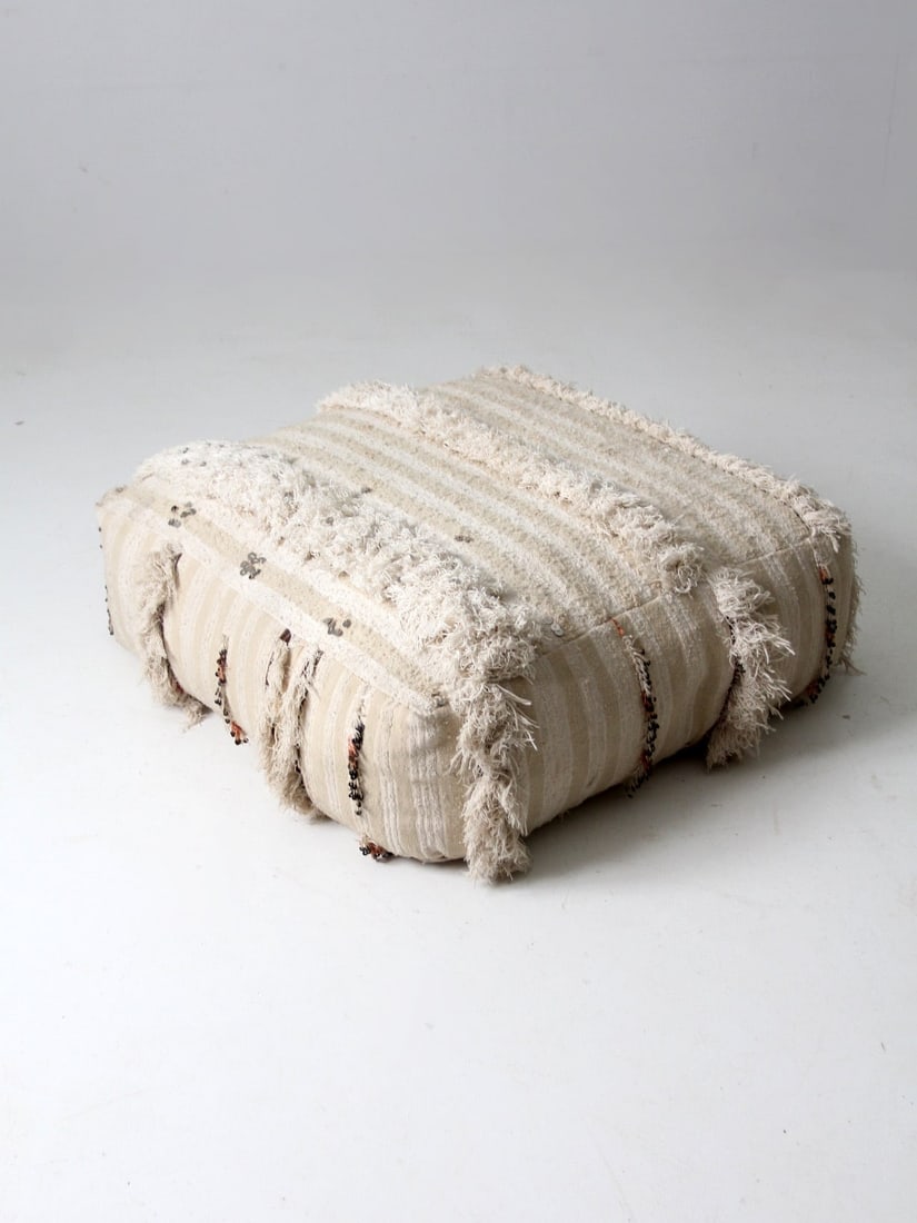 Vintage Moroccan Style Pouf Cream Beige Striped with Fringe and Sequins: Vintage Moroccan Style Pouf Cream Beige Striped with Fringe and Sequins Introducing a vintage Moroccan style floor pillow, perfect for adding a touch of bohemian charm to your space. This large floor 