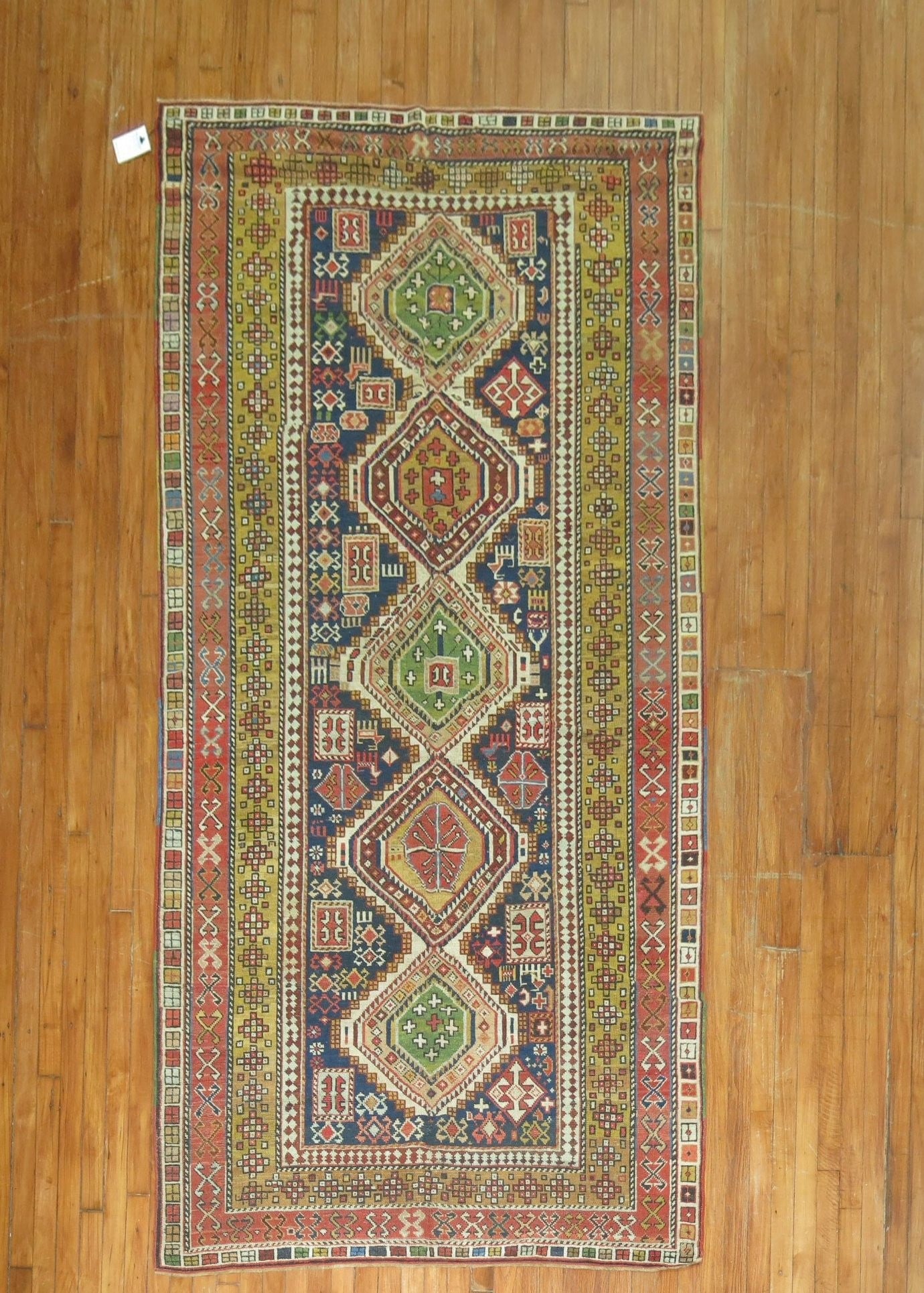 4' 7" x 9' Early 20th Century Shirvan Caucasian Rug: 4' 7" x 9' Early 20th Century Shirvan Caucasian Rug Early 20th century Shirvan rug with a rectangular form and a colorful geometric pattern. This pre-owned rug reflects the traditional Shirvan style a