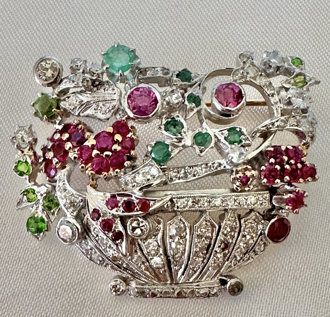 French 14k Yellow Gold Diamond Ruby Emerald Garnet Brooch: French 14k Yellow Gold Diamond Ruby Emerald Garnet Brooch This stunning French brooch combines luxury and artistry, featuring a blend of 14k yellow gold, diamonds, rubies, emeralds, and garnets. Weigh