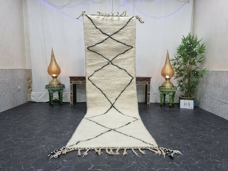 Moroccan Handwoven White Runner Rug 100% Sheep Wool 2 x 6.56 Feet: Moroccan Handwoven White Runner Rug 100% Sheep Wool 2 x 6.56 Feet Enhance your space with this White Authentic Runner Rug, meticulously handwoven in the Atlas Mountains by skilled local Berber women w