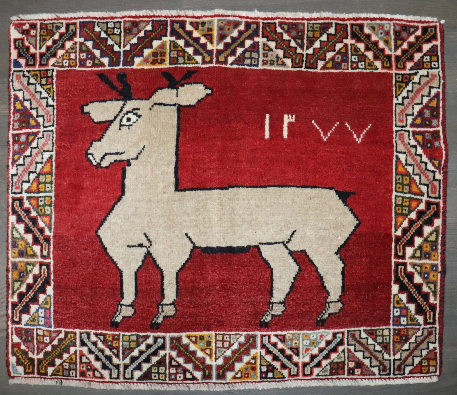 2' 2" x 2' 8" Pictorial Gabbeh Yastik Rug Deer Motif: 2' 2" x 2' 8" Pictorial Gabbeh Yastik Rug Deer Motif Vintage Gabbeh pictorial rug featuring a deer motif on a madder red field. This pre-owned piece dates to the 3rd quarter of the 20th century. Speci