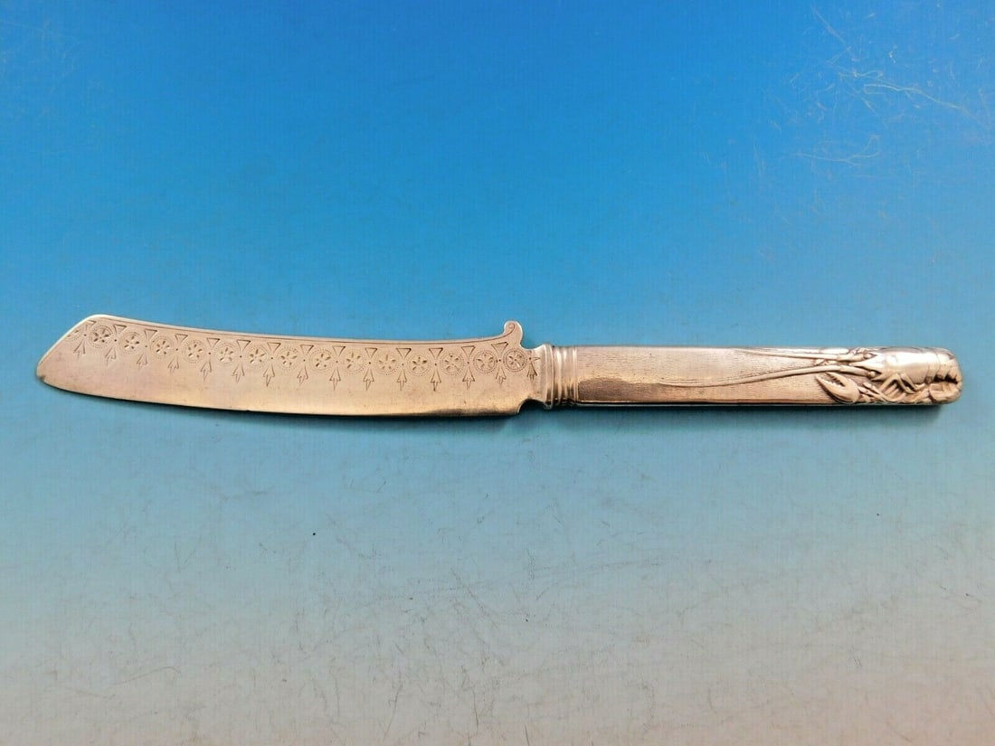 Art Silver 1860-1883 Sterling Silver Fish Knife with Lobster Design 8": Art Silver 1860-1883 Sterling Silver Fish Knife with Lobster Design 8" This exquisite fish knife, dating from 1860 to 1883, showcases the artistry of the Art Silver period. Crafted from sterling silve