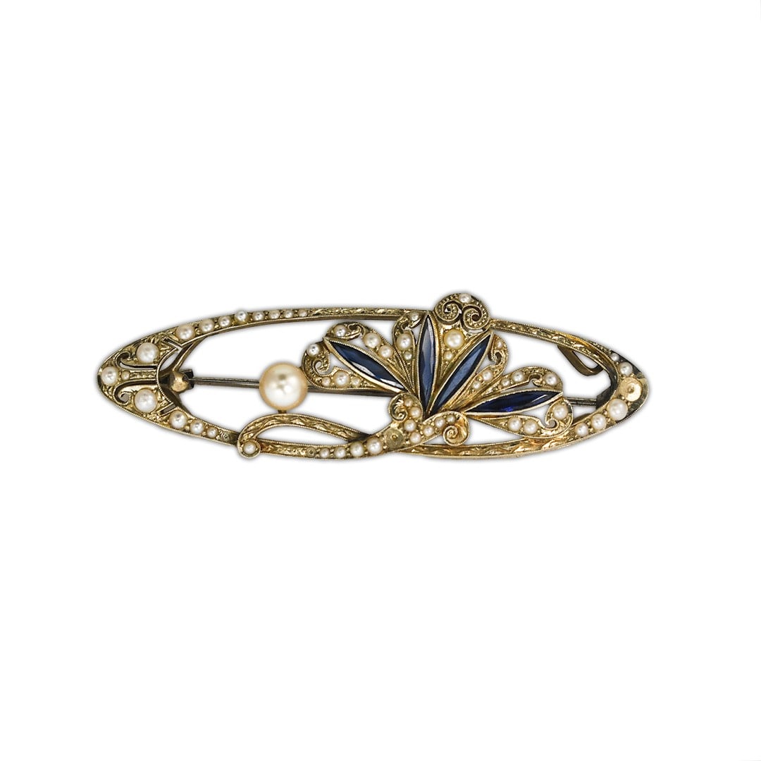 Antique Pearl and Blue Sapphire Brooch in 18K White Gold 9.8g: Antique Pearl and Blue Sapphire Brooch in 18K White Gold 9.8g Antique brooch featuring small natural pearls and blue sapphires in an asymmetrical design. The piece is set in 18k white gold with scroll
