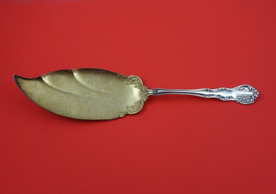 Wallace Old Atlanta Sterling Silver Fish Server Gold Wash 11 1/4": Wallace Old Atlanta Sterling Silver Fish Server Gold Wash 11 1/4" Enhance your dining experience with this exquisite Old Atlanta fish server by Wallace. Crafted from high-quality sterling silver, this