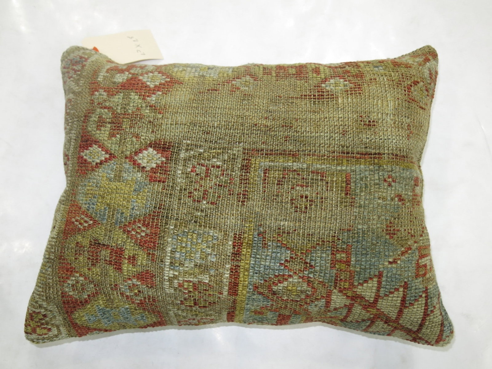 1' 3" x 1' 8" Persian Mahal Pillow: 1' 3" x 1' 8" Persian Mahal Pillow Decorative pillow made from an early 20th century Persian Mahal rug. It features a geometric pattern in earthy green, red, and blue tones and is offered in pre-owned