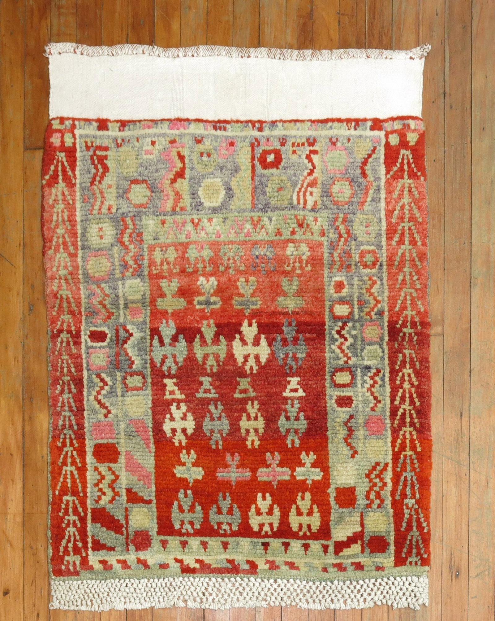 2' 9" x 3' 8" Turkish Anatolian Rug Red: 2' 9" x 3' 8" Turkish Anatolian Rug Red Vintage Anatolian rug from Turkey dating to the mid 20th century. This pre-owned piece features a red colorway and a small-format design suitable for a variety 