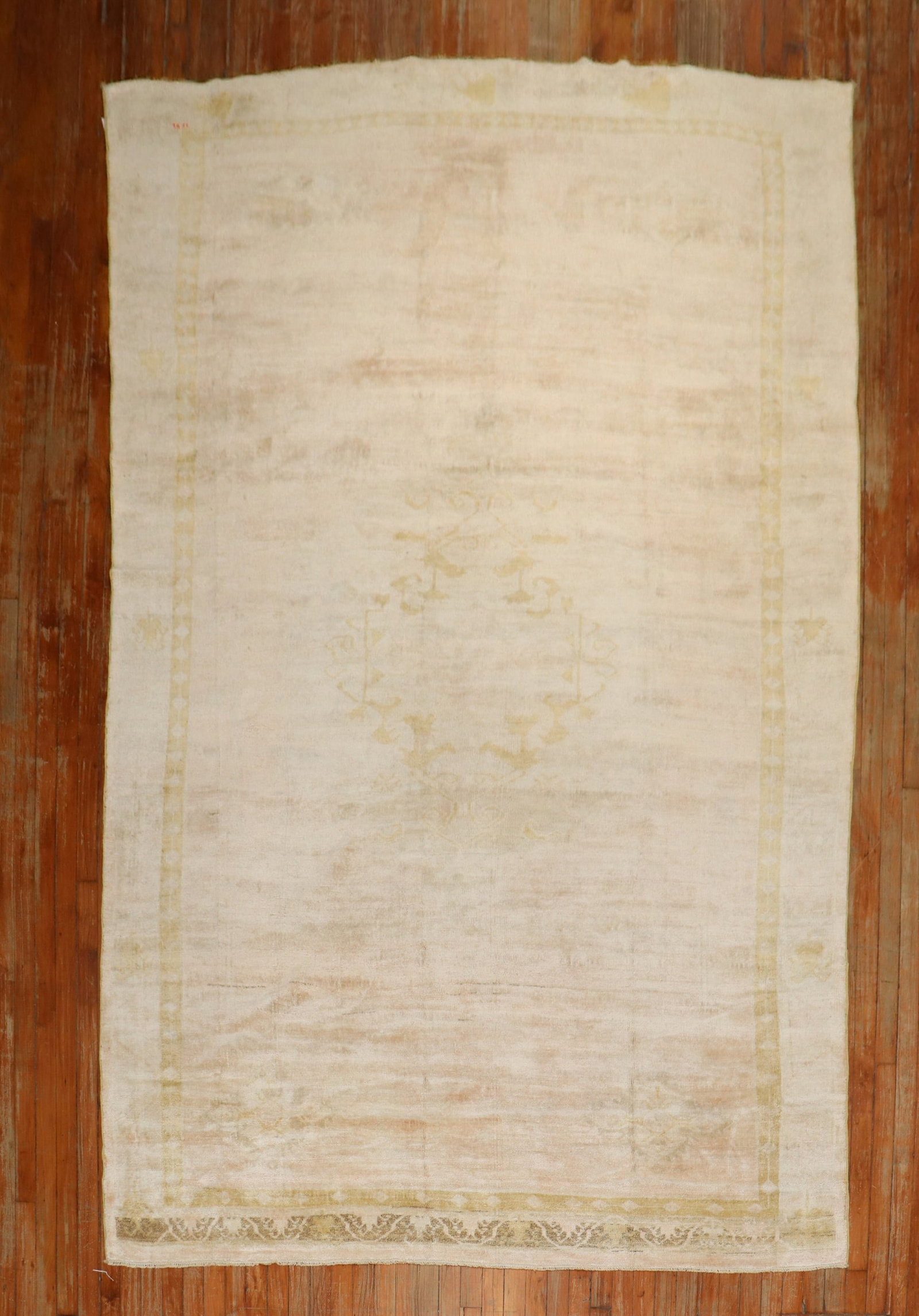 6' 7" x 11' 8" Anatolian Turkish Gallery Rug in Light Pink: 6' 7" x 11' 8" Anatolian Turkish Gallery Rug in Light Pink Mid 20th century Turkish gallery rug in a primarily light pink color palette. This pre-owned Anatolian rug features a subtle patterned field 