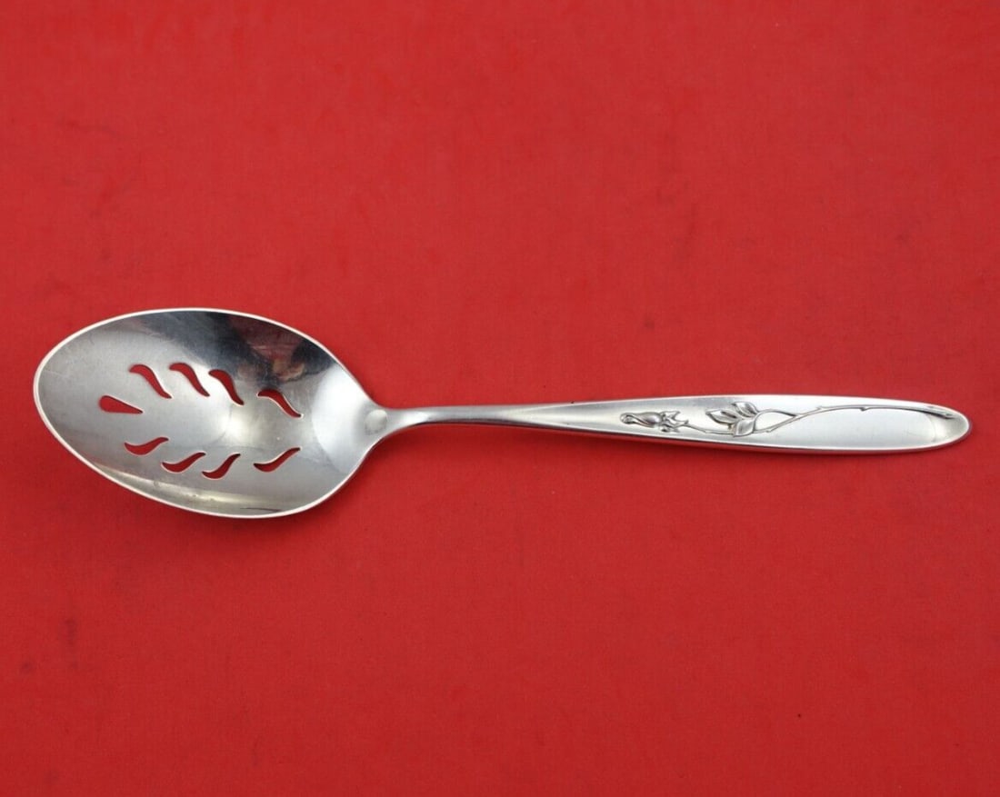 Towle Rose Solitaire Sterling Silver Slotted Serving Spoon 8 5/8": Towle Rose Solitaire Sterling Silver Slotted Serving Spoon 8 5/8" This exquisite serving spoon features the elegant Rose Solitaire pattern by Towle, crafted from fine sterling silver. The slotted desi