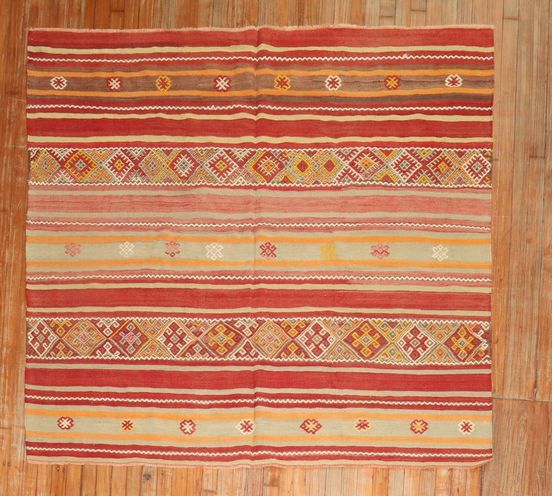 5' 6" x 5' 10" Turkish Striped Kilim Rug: 5' 6" x 5' 10" Turkish Striped Kilim Rug Pre-owned Turkish square kilim from the middle of the 20th century with a striped design. Specifications Type: Kilim Origin: Turkish Category: Square Design: S