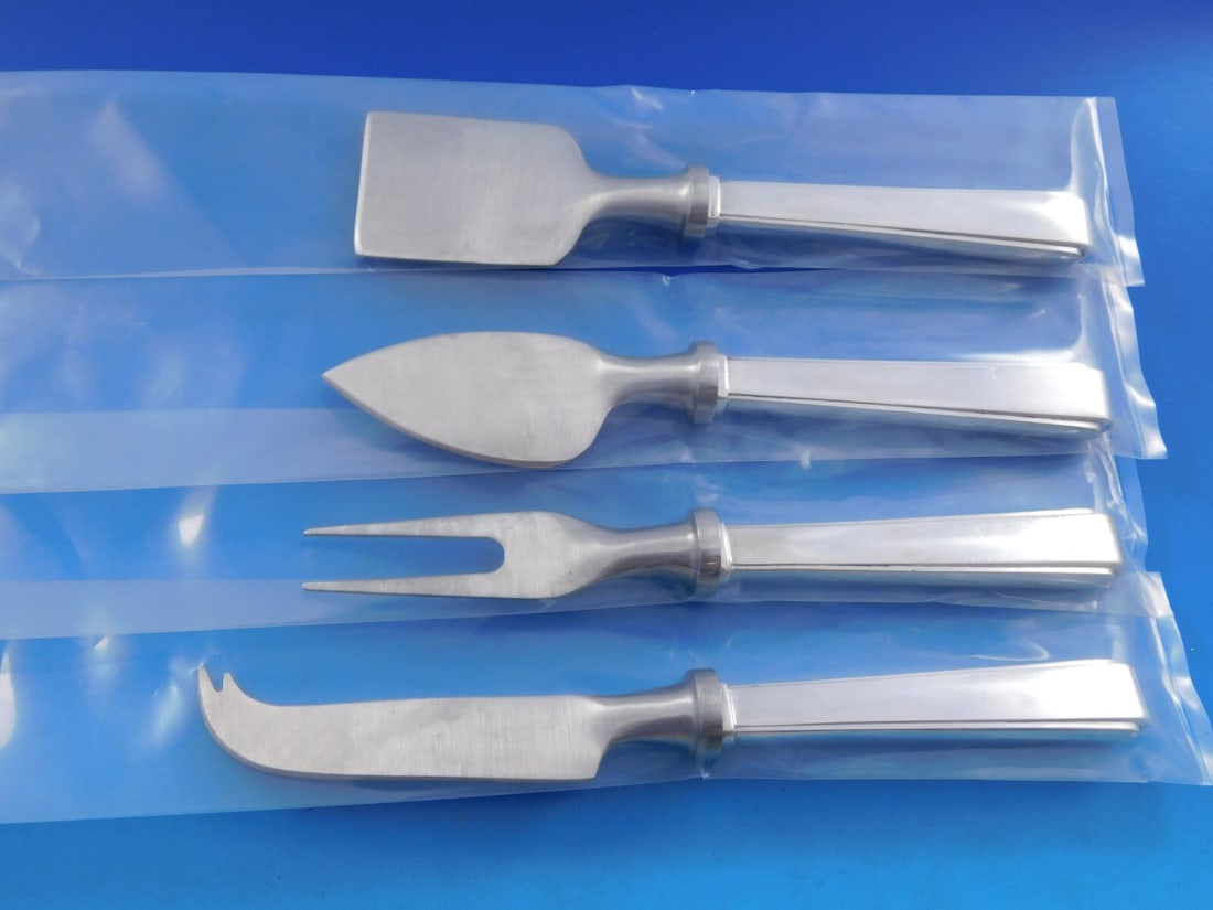 Lunt Modern Classic Sterling Silver 4 Piece Cheese Serving Set: Lunt Modern Classic Sterling Silver 4 Piece Cheese Serving Set This exquisite 4-piece cheese serving set, part of the Modern Classic pattern by Lunt, is crafted from sterling silver with hollow handle