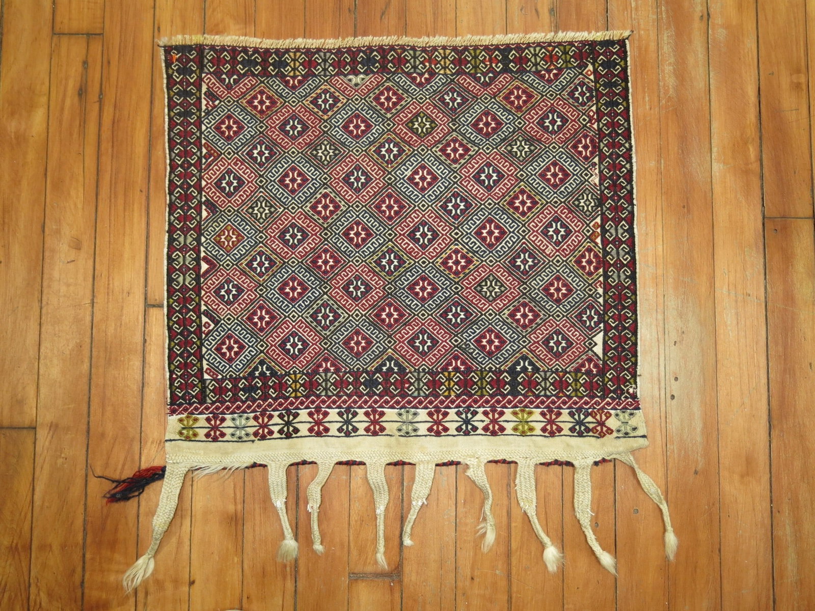 1' 6" x 1' 8" Persian Soumac Kilim Yastik: 1' 6" x 1' 8" Persian Soumac Kilim Yastik Middle 20th century Persian flatwoven Soumac textile rug. This pre-owned piece is identified as a kilim and Soumac textile in a square yastik format. Specific