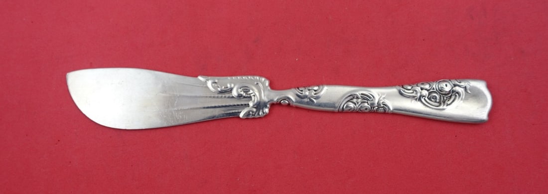 Whiting Rose and Scroll Sterling Silver Fish Knife 7 3/4": Whiting Rose and Scroll Sterling Silver Fish Knife 7 3/4" Discover the elegance of the Rose and Scroll Sterling Silver Fish Knife by Whiting, crafted between 1850 and 1899. This exquisite piece featur