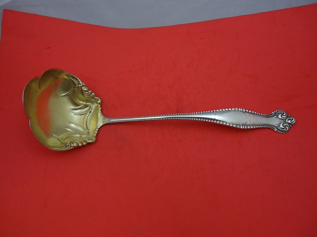 Towle Canterbury Sterling Silver Gold Washed Soup Ladle 13 Inch: Towle Canterbury Sterling Silver Gold Washed Soup Ladle 13 Inch Elevate your dining experience with this exquisite Canterbury soup ladle by Towle. Crafted from high-quality sterling silver, this 13-in