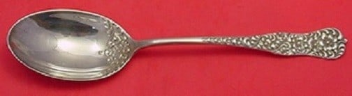 Dominick & Haff Rococo Sterling Silver Ovoid Stuffing Spoon with Flower: Dominick & Haff Rococo Sterling Silver Ovoid Stuffing Spoon with Flower This exquisite Rococo serving spoon, crafted by Dominick & Haff, showcases a beautiful ovoid shape adorned with a delicate flowe