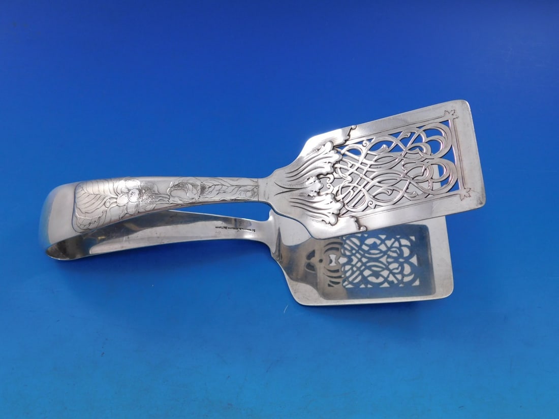 Tiffany Sterling Silver Lap Over Edge Acid Etched Asparagus Server 7.75": Tiffany Sterling Silver Lap Over Edge Acid Etched Asparagus Server 7.75" This exquisite asparagus server is a stunning piece from Tiffany & Co., showcasing the elegant Lap Over Edge Acid Etched patter