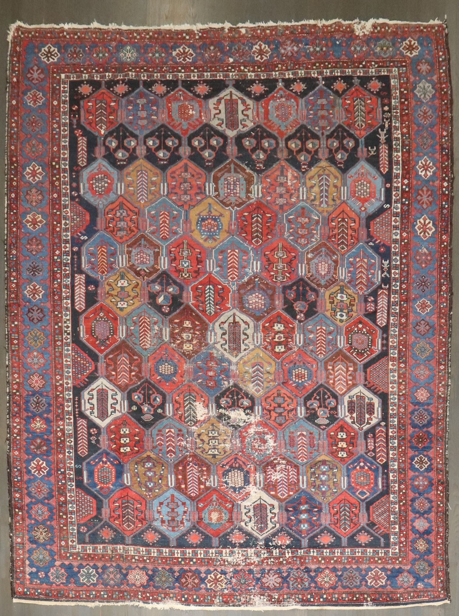 7' 3" x 9' 5" Distressed Persian Bakhtiari Carpet Early 20th Century: 7' 3" x 9' 5" Distressed Persian Bakhtiari Carpet Early 20th Century Distressed Persian Bakhtiari rug from the early 20th century with a worn look and Shabby Chic style. Pre-owned condition.