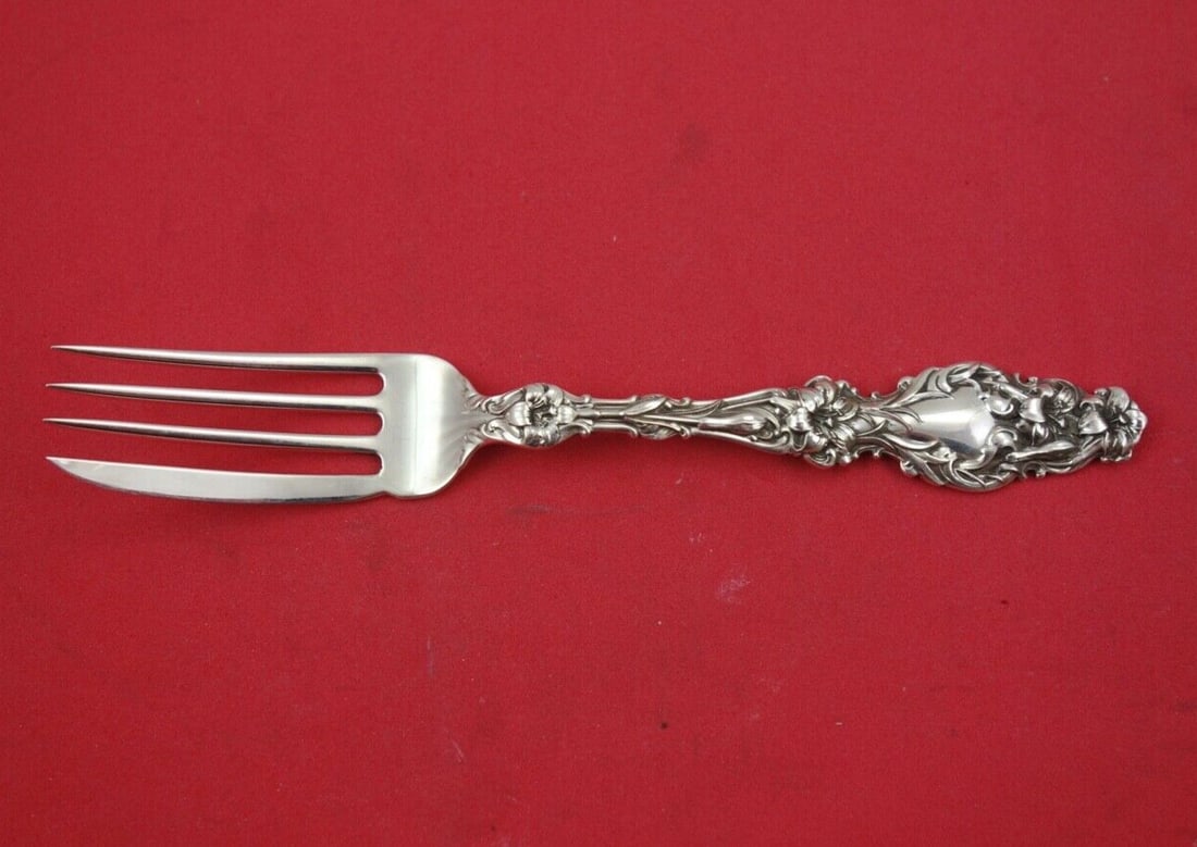 Frank M Whiting Lily Sterling Silver Fish Fork 6 3/4": Frank M Whiting Lily Sterling Silver Fish Fork 6 3/4" Discover the exquisite beauty of the Lily pattern by Frank M. Whiting with this sterling silver fish fork. Measuring 6 3/4 inches, this all