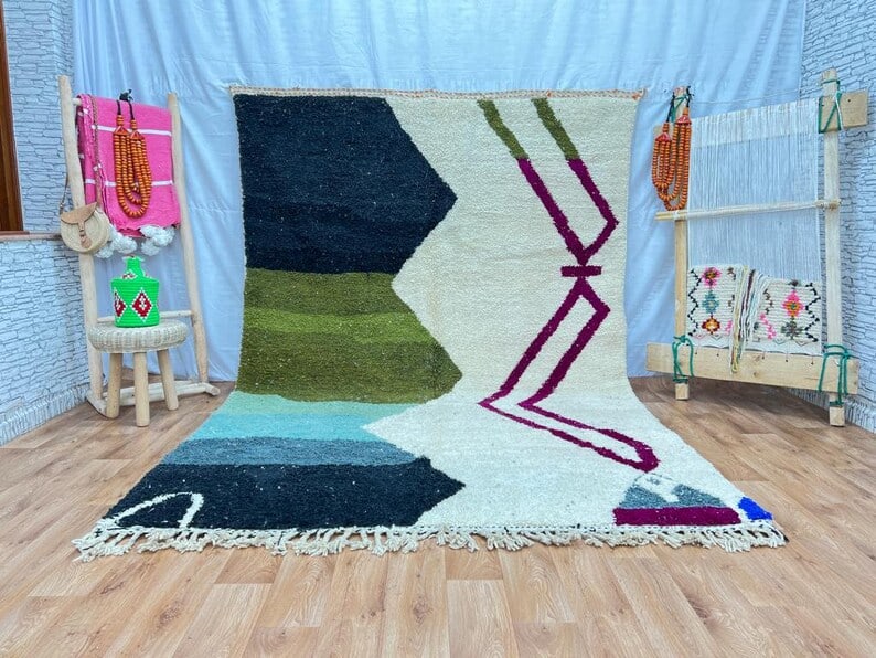 Handwoven Colorful Moroccan Rug 100% Sheep Wool 8 x 5 Feet: Handwoven Colorful Moroccan Rug 100% Sheep Wool 8 x 5 Feet This beautiful authentic soft colorful rug is handwoven in the Atlas Mountains by local Berber women weavers. Crafted using traditional tools