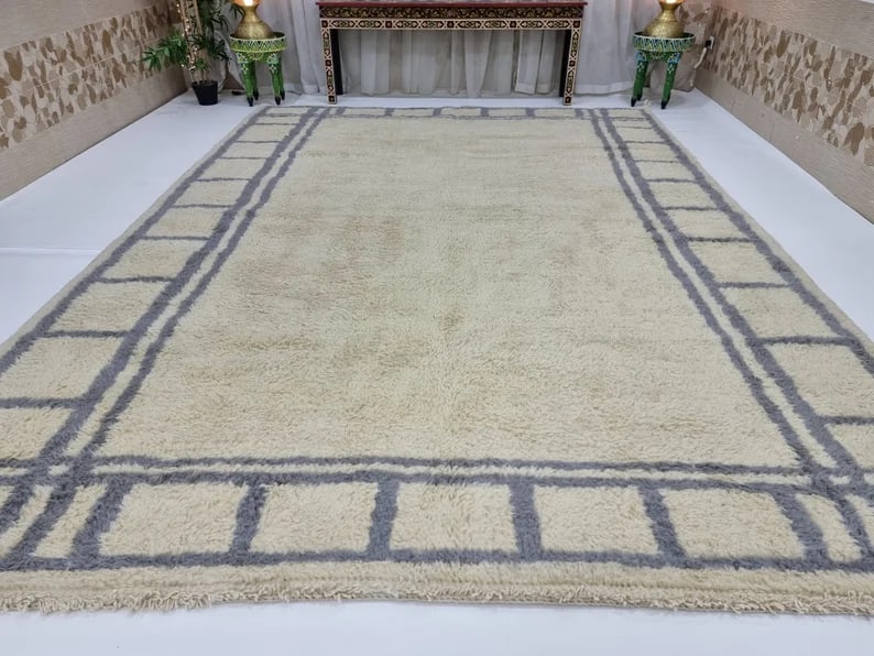 Authentic Handmade Wool Rug from Morocco 9.84 x 6.56 Feet: Authentic Handmade Wool Rug from Morocco 9.84 x 6.56 Feet Elevate your living space with this stunning handmade wool rug. Crafted by skilled local Berber women weavers in the Atlas Mountains of Morocc
