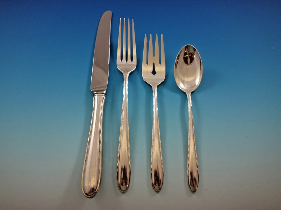 Towle Silver Flutes Sterling Silver 4-Piece Place Setting: Towle Silver Flutes Sterling Silver 4-Piece Place Setting Enhance your dining experience with this exquisite 4-piece place setting from Towle, crafted in sterling silver. The Silver Flutes pattern fea