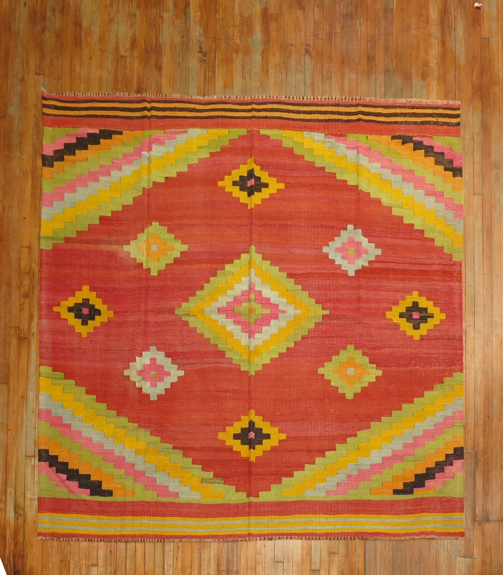8' 10" x 8' 9" Anatolian square kilim rug: 8' 10" x 8' 9" Anatolian square kilim rug Square Turkish kilim from the middle of the 20th century with a colorful geometric design. This pre-owned Anatolian kilim features a square format and traditi
