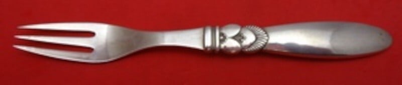 Georg Jensen Cactus Sterling Silver Fruit Fork 6 inches GI/GJ Mark: Georg Jensen Cactus Sterling Silver Fruit Fork 6 inches GI/GJ Mark Introducing the Cactus Fruit Fork by Georg Jensen, a stunning piece crafted from sterling silver. This fork features the renowned Cac