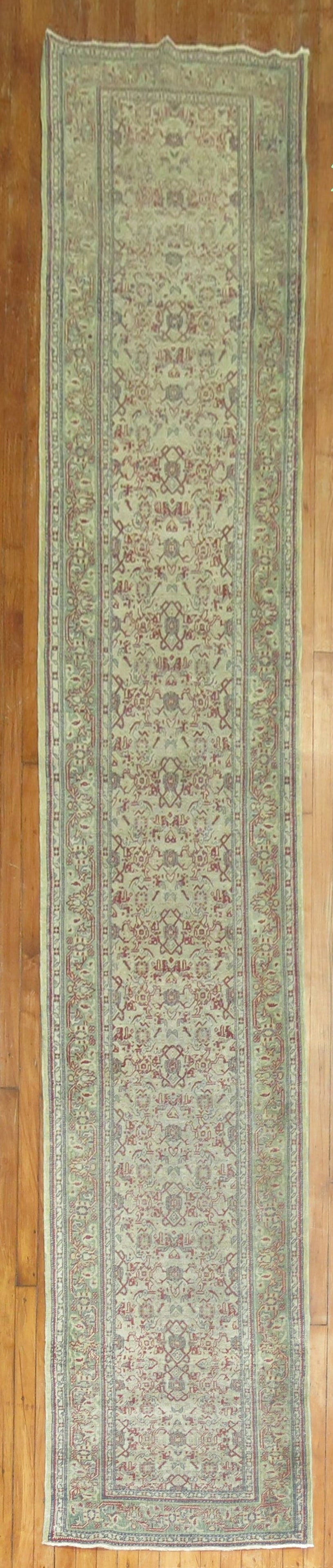 2' 6" x 15' 4" Early 20th Century Turkish Sivas Rug Runner: 2' 6" x 15' 4" Early 20th Century Turkish Sivas Rug Runner Early 20th century Turkish Sivas runner with a gray muddy field and green and red accents. This pre-owned piece is categorized as a shabby ch