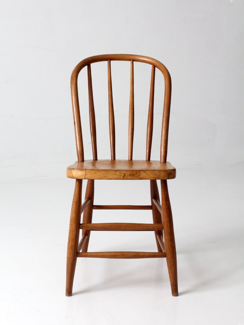 Antique Side Chair Windsor Bow Back Plank Seat 33 inch: Antique Side Chair Windsor Bow Back Plank Seat 33 inch Antique Windsor side chair with a classic bow-back silhouette, sculpted plank seat, turned legs, and slender spindles. Its simple handcrafted for