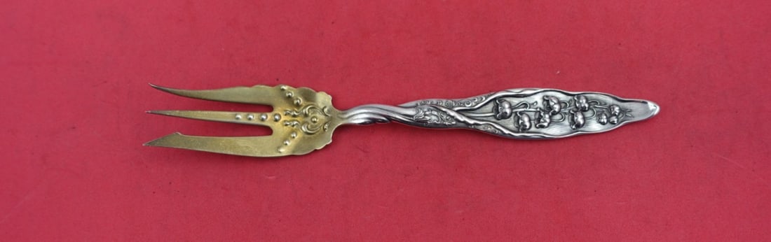 Whiting Lily of the Valley Sterling Silver Pickle Pastry Fork 6 1/4": Whiting Lily of the Valley Sterling Silver Pickle Pastry Fork 6 1/4" This exquisite pickle or pastry fork showcases the elegant 'Lily of the Valley' pattern by Whiting. Crafted from high-quality sterl