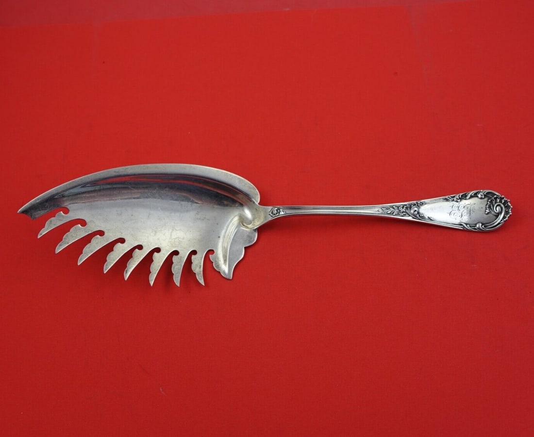 Dominick & Haff Louis XIV Old Style Sterling Silver Macaroni Server 10.5": Dominick & Haff Louis XIV Old Style Sterling Silver Macaroni Server 10.5" This exquisite macaroni server features the elegant Louis XIV Old Style pattern by Dominick & Haff. Crafted from high-quality 