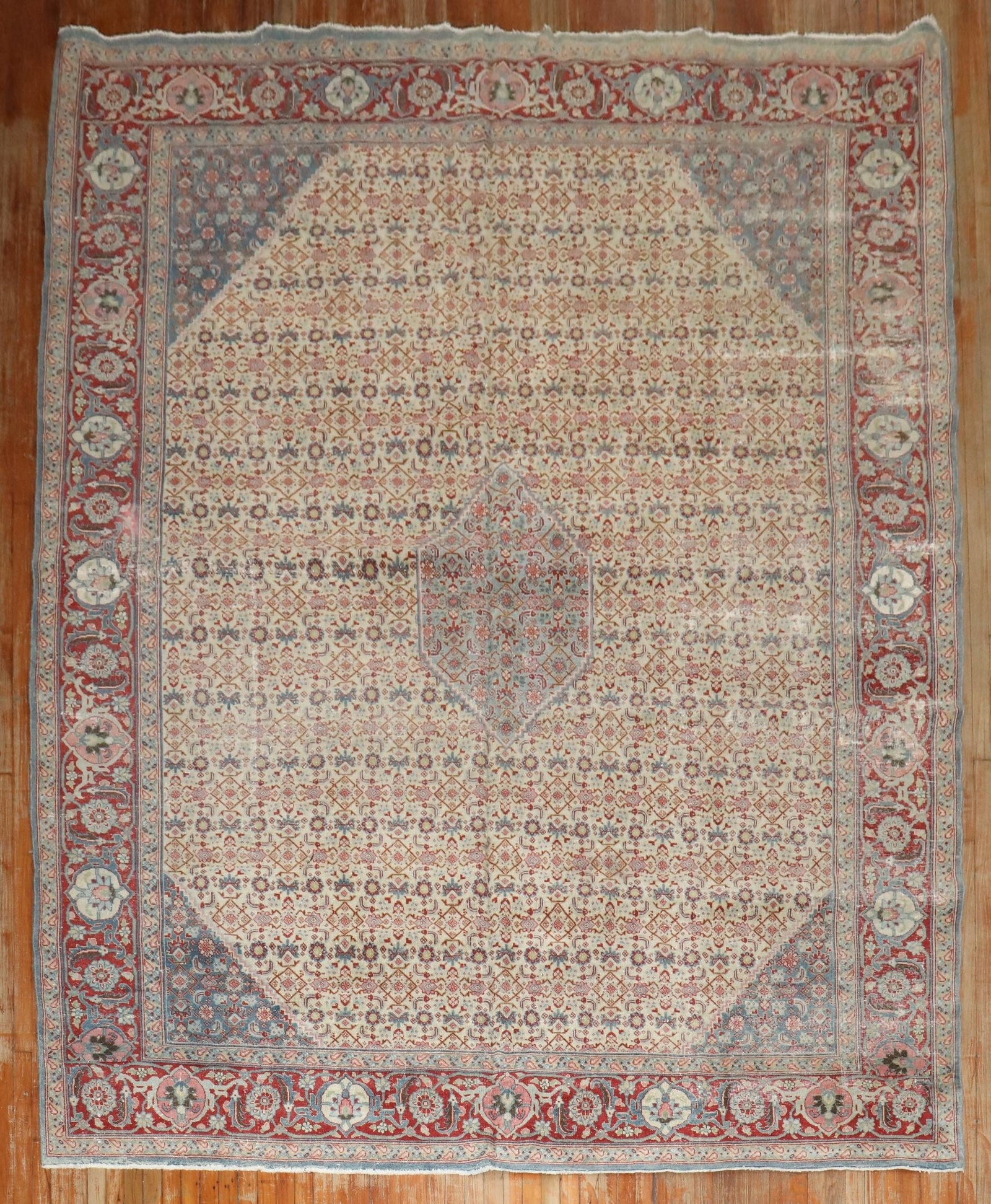 9' 6" x 13' 6" Early 20th Century Persian Tabriz Rug: 9' 6" x 13' 6" Early 20th Century Persian Tabriz Rug Early 20th century worn Persian Tabriz rug with a shabby chic look. This pre-owned room-size rug features the character and patina associated with 