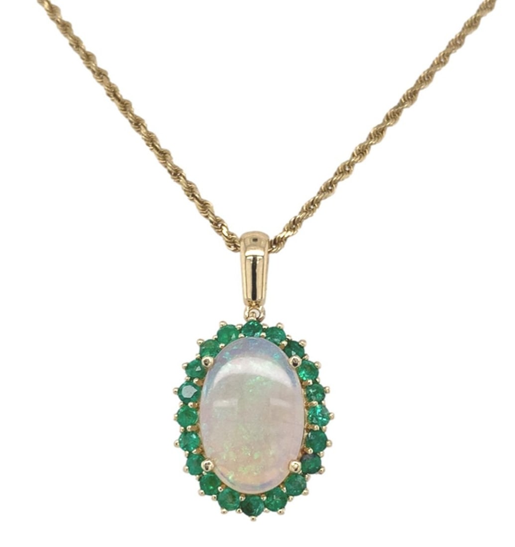 Unbranded 14k Yellow Gold Opal Pendant Necklace with Emeralds 2.83 Carat: Unbranded 14k Yellow Gold Opal Pendant Necklace with Emeralds 2.83 Carat Pre-owned women's pendant necklace in 14k yellow gold featuring an Australian genuine opal accented with emeralds. The pendant 